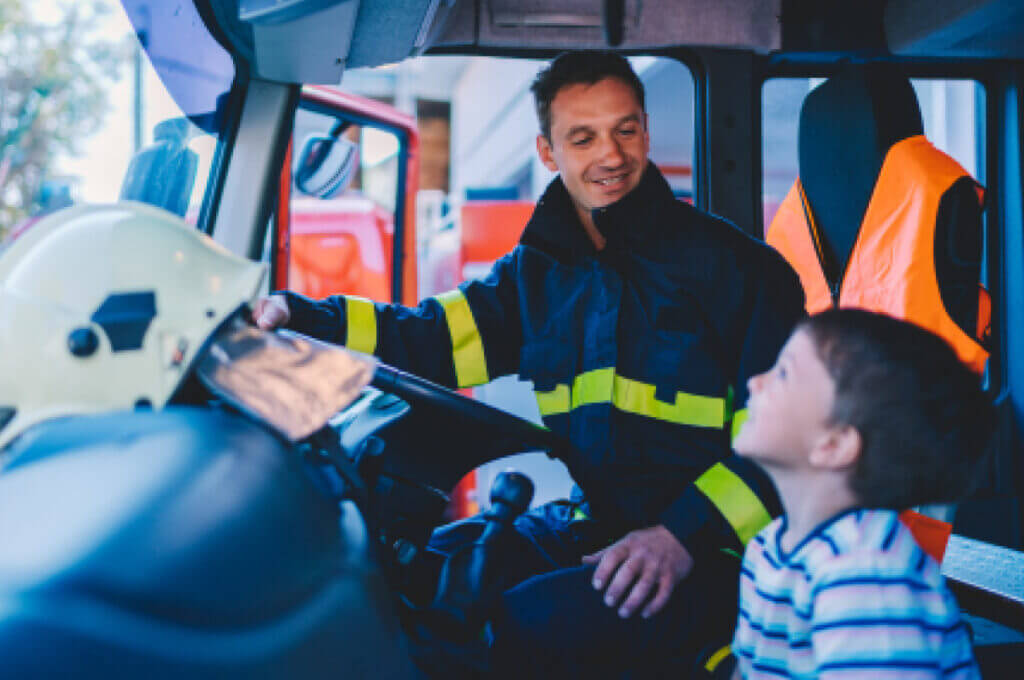 Fireman and child in fire engine