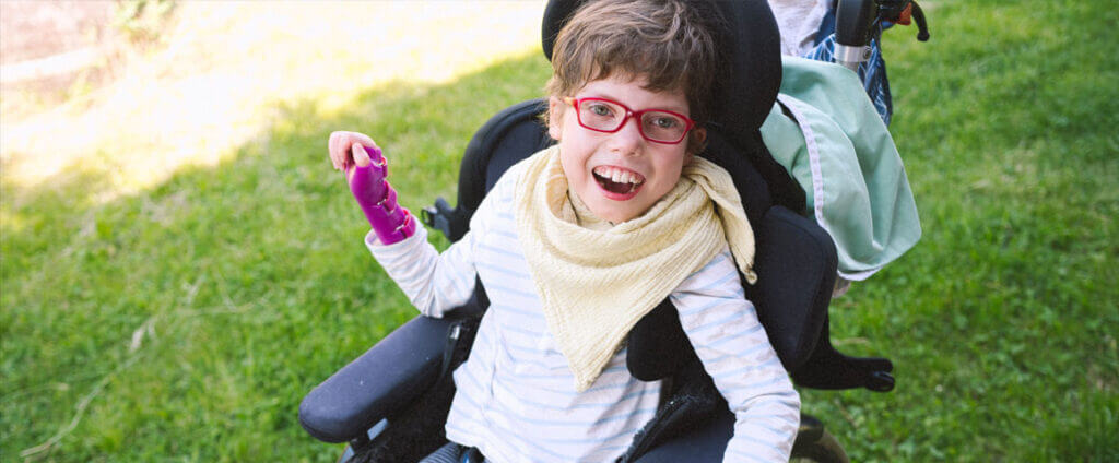 Girl smiling in wheel chair